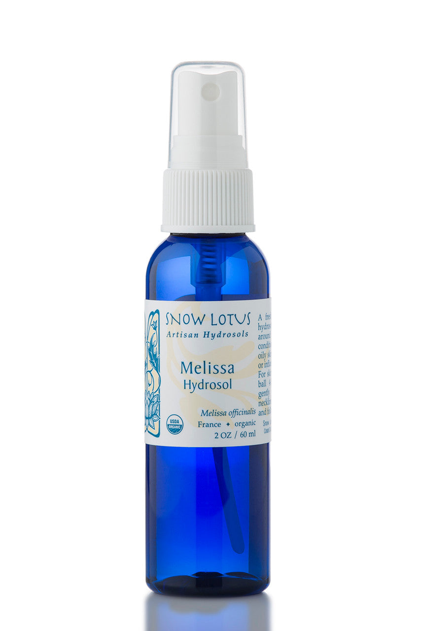 Snow Lotus organic Melissa Hydrosol (Lemon Balm Water) in a blue spray bottle