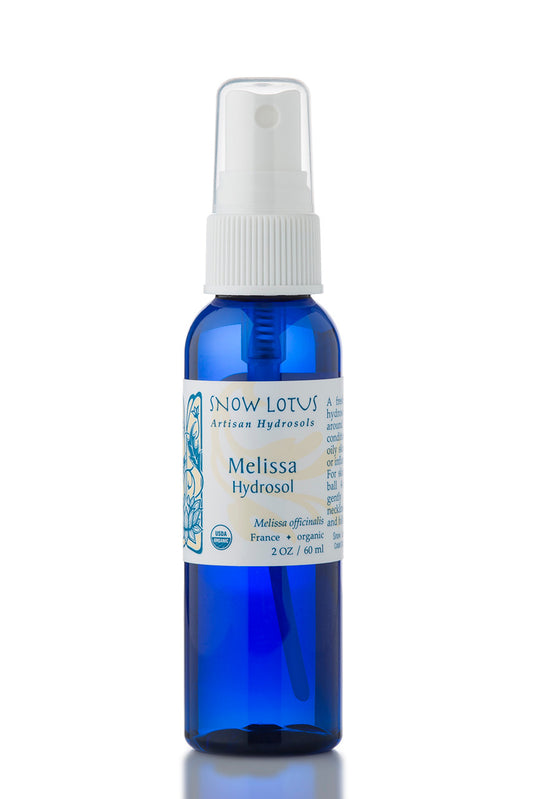 Snow Lotus organic Melissa Hydrosol (Lemon Balm Water) in a blue spray bottle