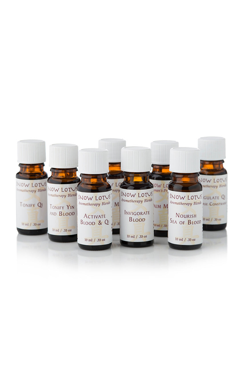 A row of Snow Lotus amber essential oil bottles