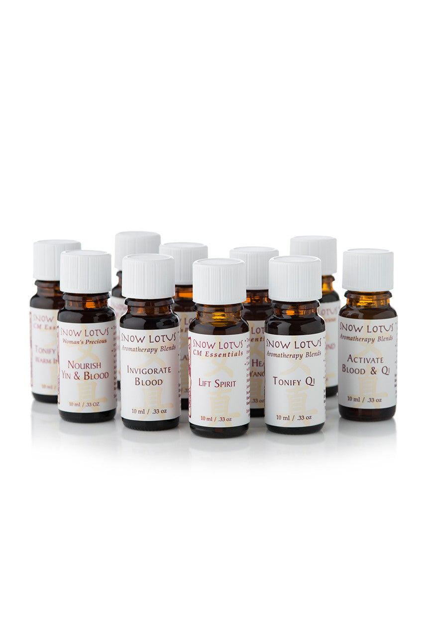 A row of Snow Lotus amber essential oil bottles