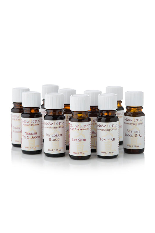 A row of Snow Lotus amber essential oil bottles