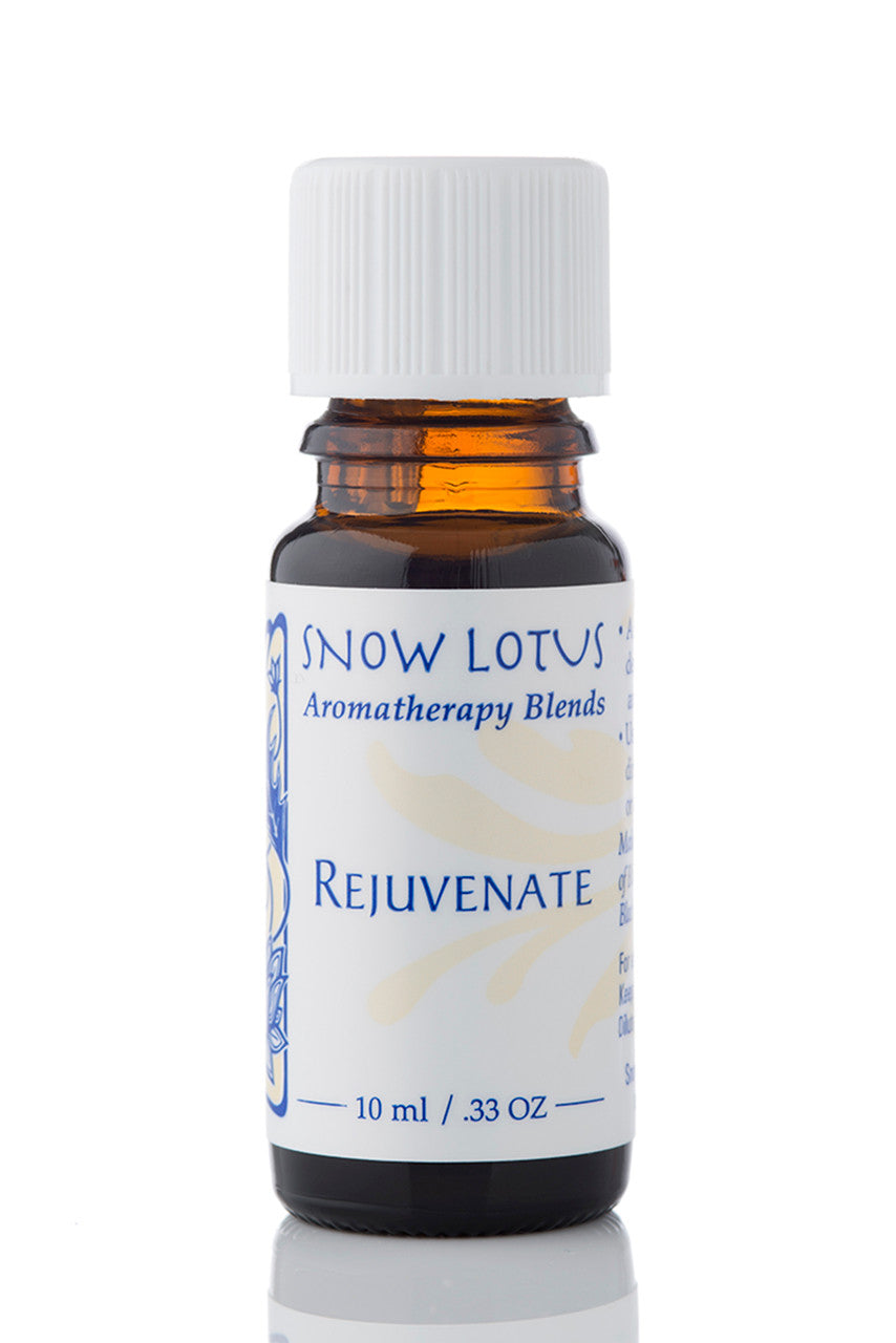 Snow Lotus Rejuvenate - Esthetic Essential Oil Blend in an amber glass bottle