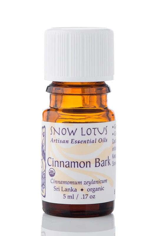 Snow Lotus organic Cinnamon Bark Essential Oil in an amber glass bottle