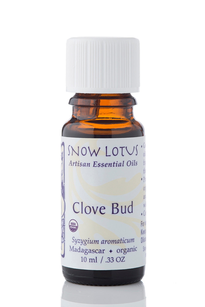 Snow Lotus organic Clove Bud Essential Oil in an amber glass bottle