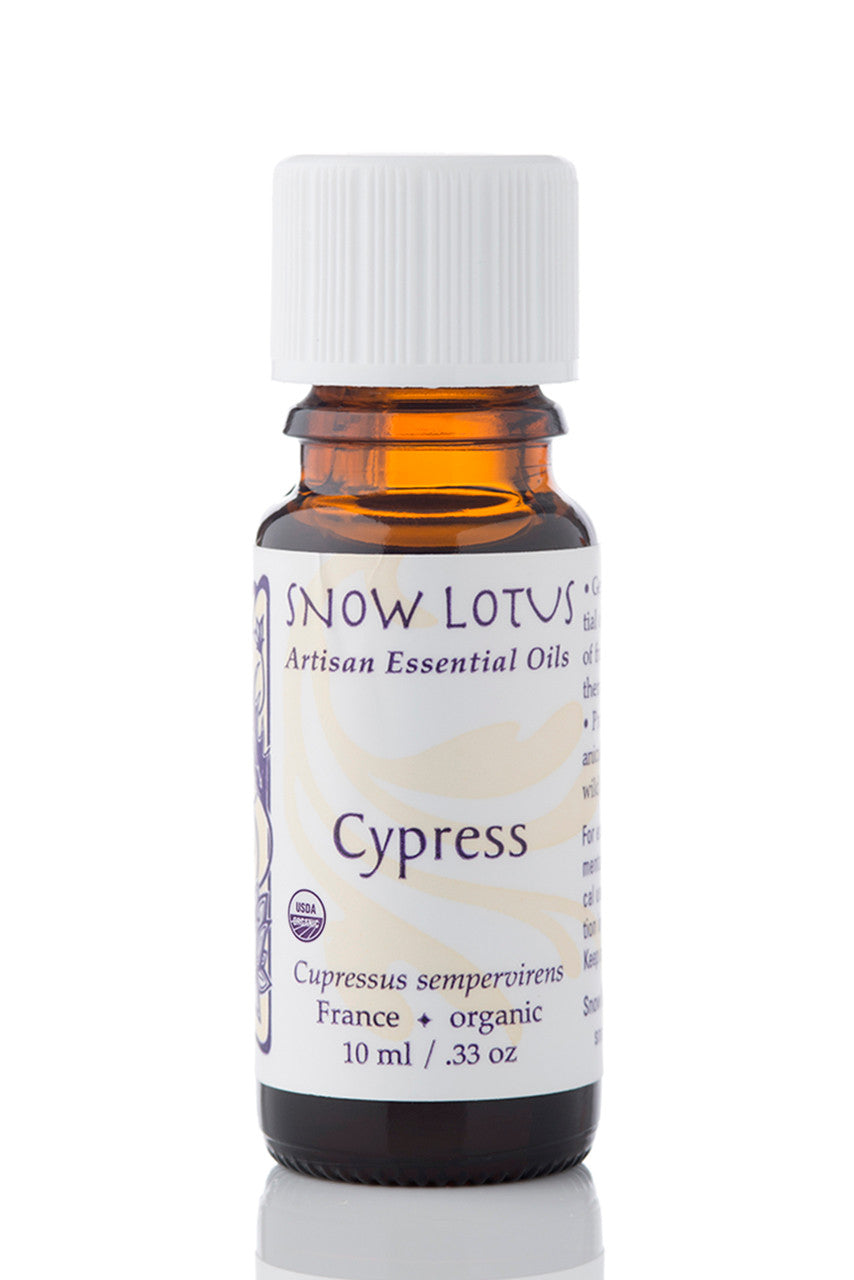 Snow Lotus organic Cypress Essential Oil in an amber glass bottle