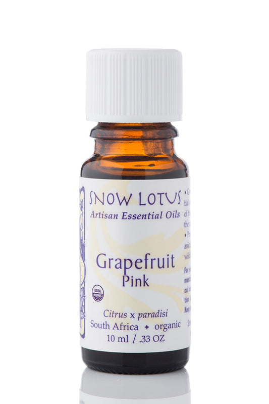 Snow Lotus organic Pink Grapefruit Essential Oil in an amber glass bottle