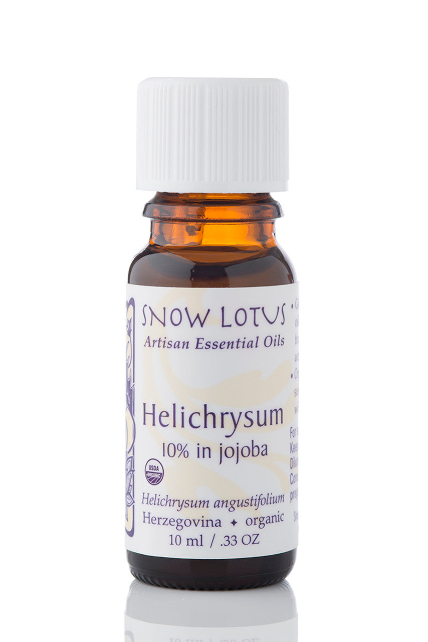 Snow Lotus Helichrysum Essential Oil 10% in Jojoba Oil in an amber glass bottle
