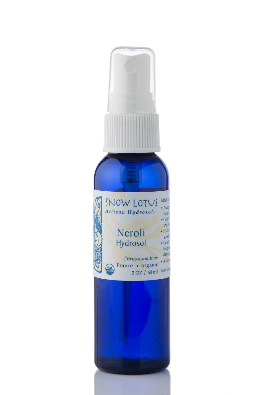 Snow Lotus organic Neroli Hydrosol (Orange Blossom Water) in a blue spray bottle