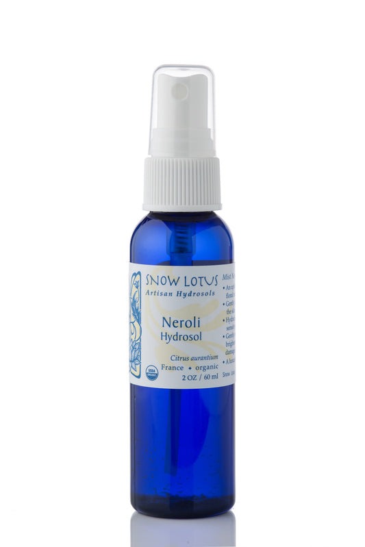 Snow Lotus organic Neroli Hydrosol (Orange Blossom Water) in a blue spray bottle