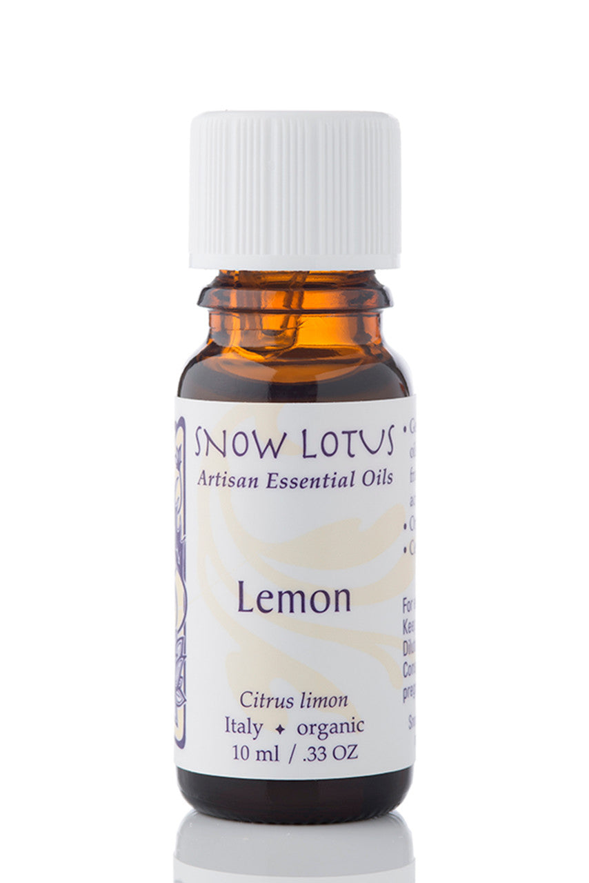 Snow Lotus organic Lemon Essential Oil in an amber glass bottle