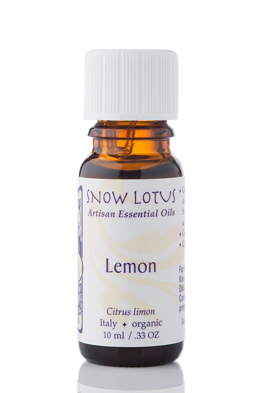 Snow Lotus organic Lemon Essential Oil in an amber glass bottle