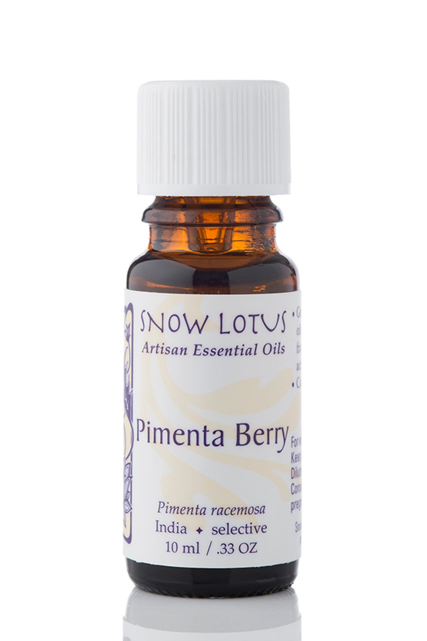 Snow Lotus Pimenta Berry Essential Oil in an amber glass bottle