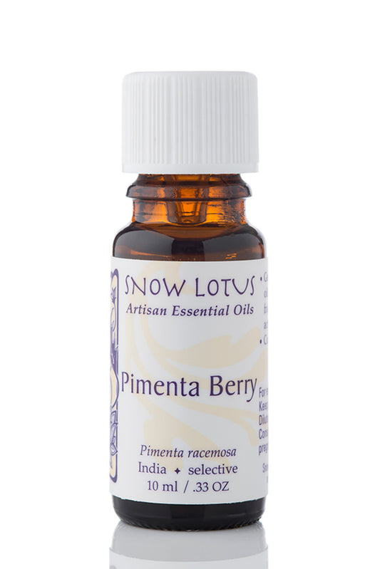 Snow Lotus Pimenta Berry Essential Oil in an amber glass bottle