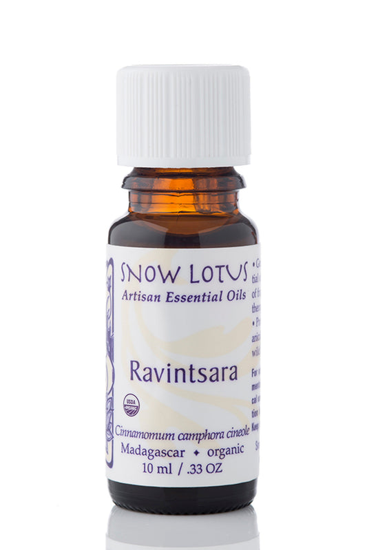 Snow Lotus organic Ravintsara Essential Oil in an amber glass bottle