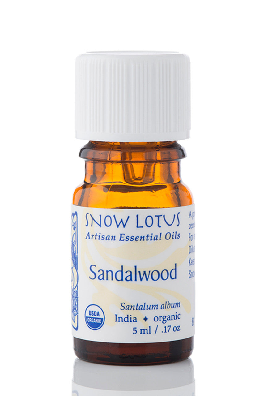 Snow Lotus Sandalwood Essential Oil in an amber glass bottle
