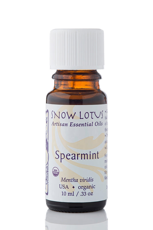 Snow Lotus Spearmint Essential Oil in an amber glass bottle