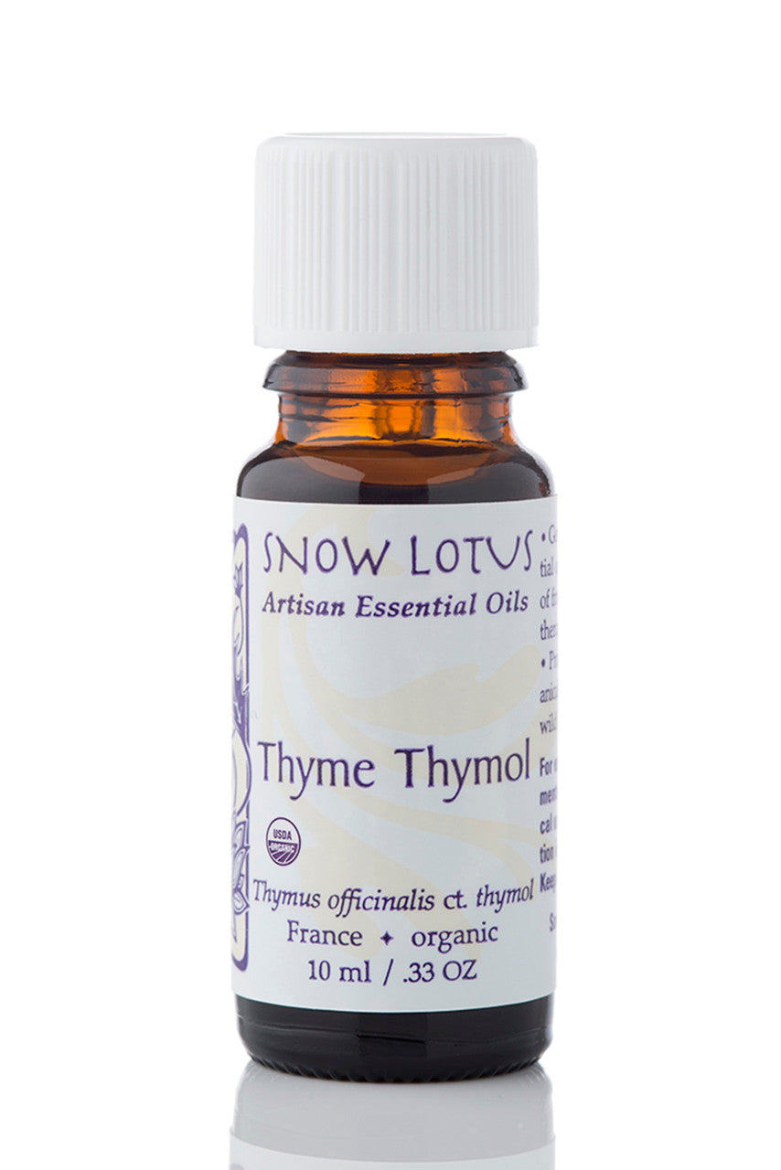 Snow Lotus organic Thyme Thymol Essential Oil in an amber glass bottle