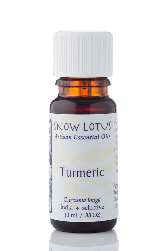 Snow Lotus Turmeric Essential Oil in an amber glass bottle