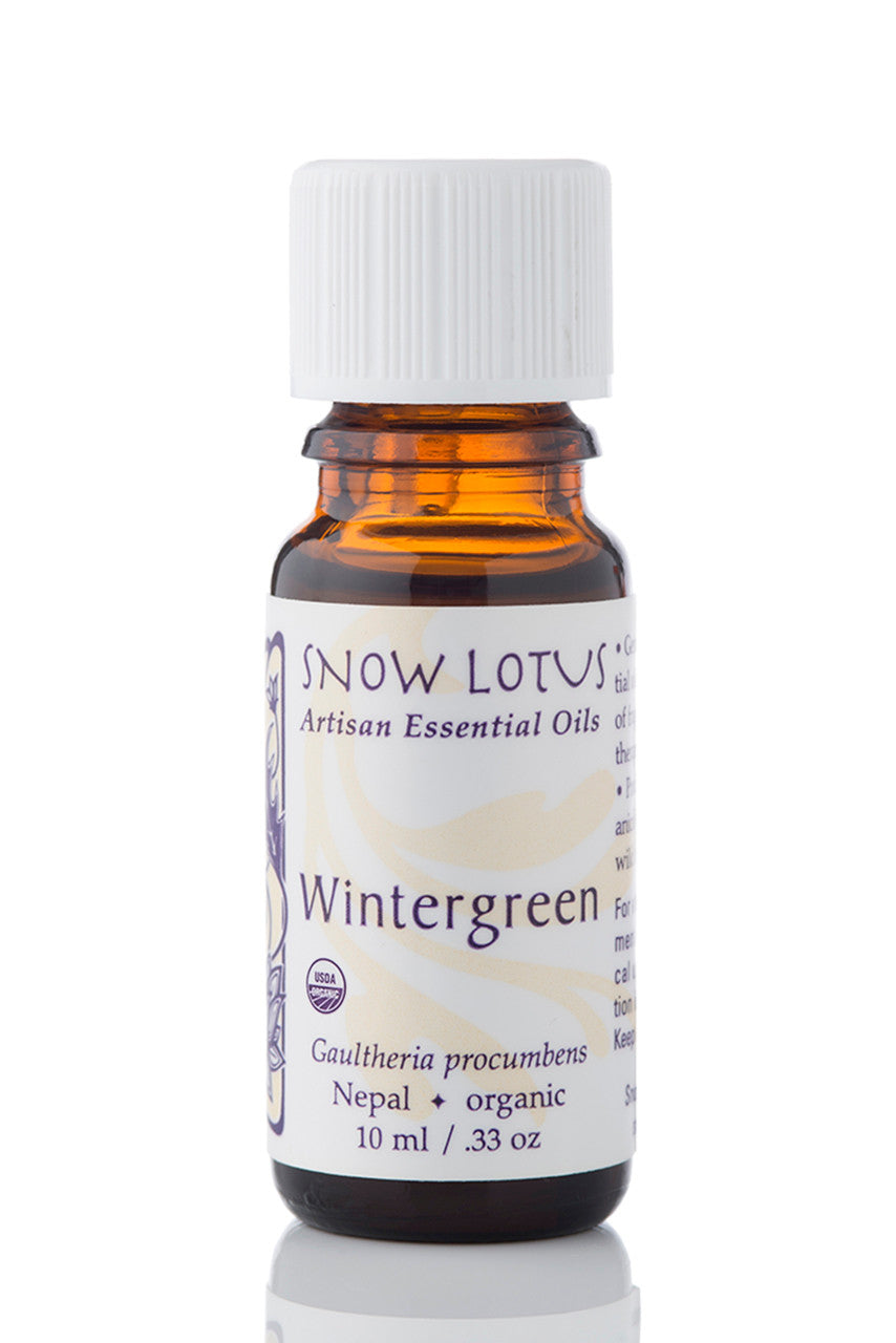 Snow Lotus organic Wintergreen Essential Oil in an amber glass bottle