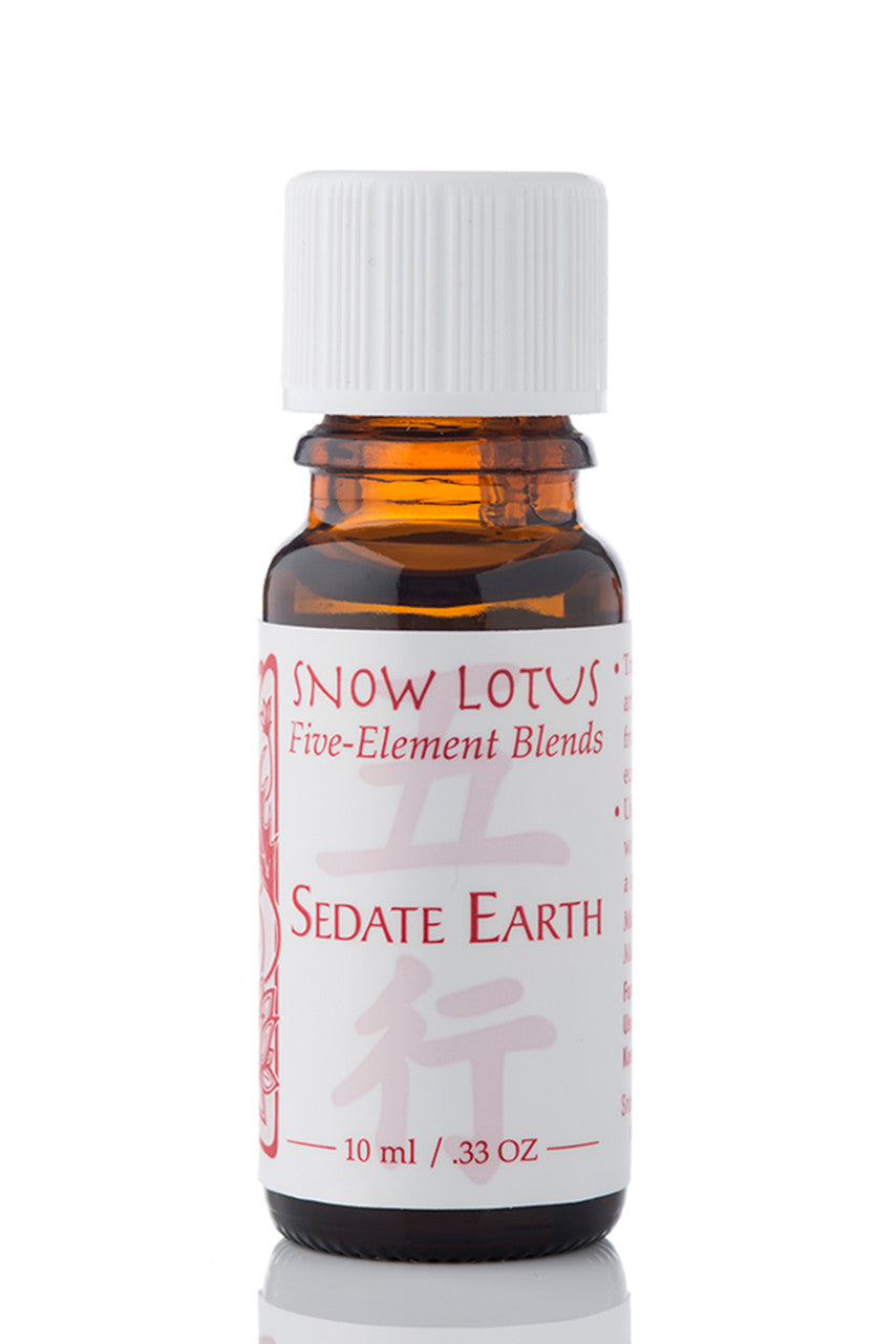 Snow Lotus Sedate Earth - Five Element Essential Oil Blend in an amber glass bottle