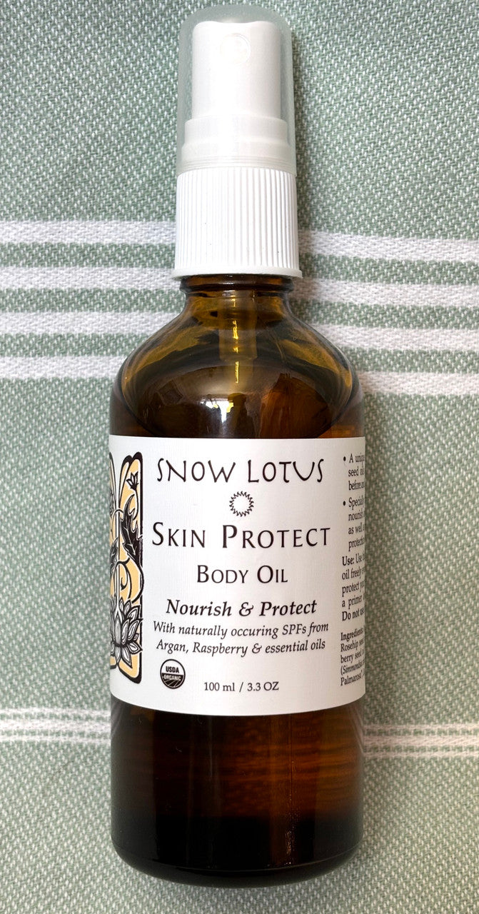 Snow Lotus Skin Protect Body Oil in an amber glass bottle, 100 ml