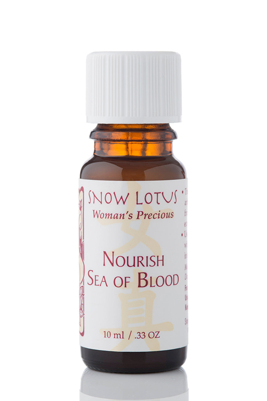 Snow Lotus Nourish Sea of Blood - Woman's Precious Blend in an amber glass bottle
