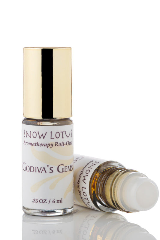 Snow Lotus Godiva's Gems - Esthetic Roll On in a roll-on bottle with a metallic cap