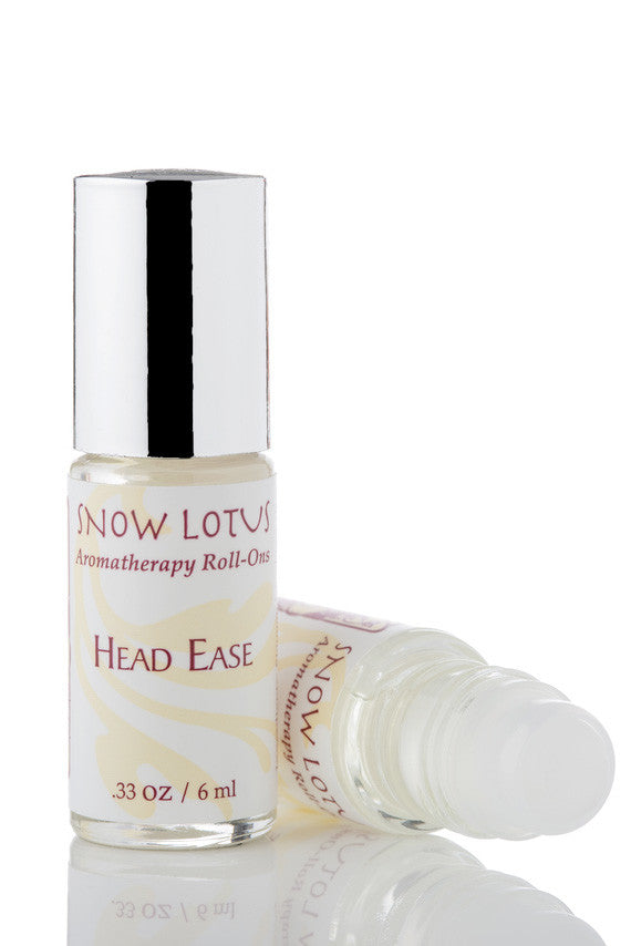 Snow Lotus Head Ease - Therapeutic Roll On in a roll-on bottle with a metallic cap