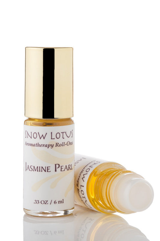 Snow Lotus Jasmine Pearl - Esthetic Roll On in a roll-on bottle with a metallic cap