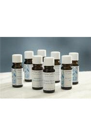 A group of Snow Lotus essential oil bottles arranged on a pale surface