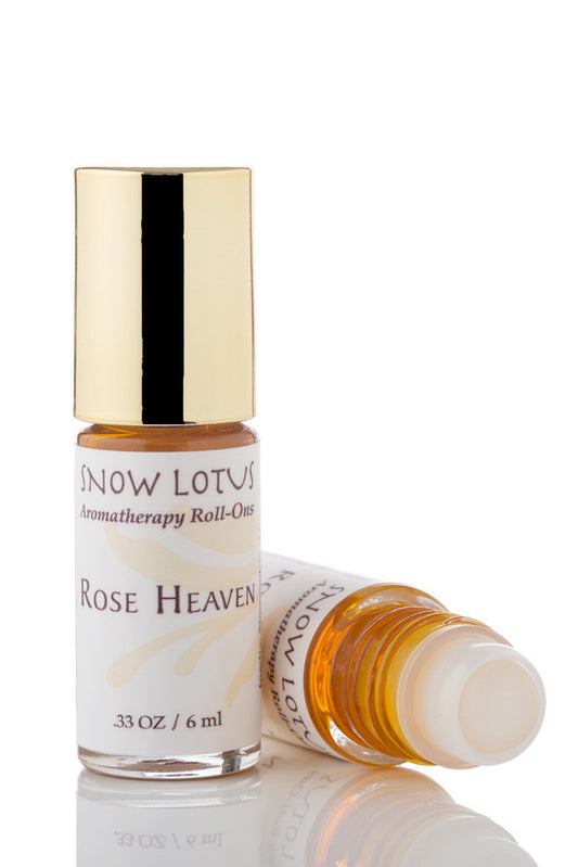 Snow Lotus Rose Heaven - Esthetic Roll On in a roll-on bottle with a metallic cap